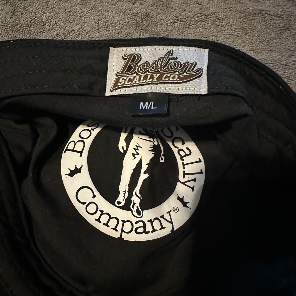A Boston Scally hat sold black. Awesome fit. Only worn 3 times. Needs a new home